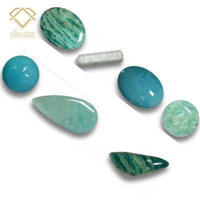 برش های از سنگ قیمتی آمازونیت به صورت دامله در رنگهای سبز و آبی